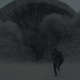 A sandworm rises from beneath the ground in the new Dune movie as a person runs away in terror.